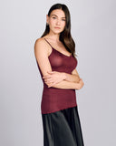 Aromatique's maroon rib silk camisole is seamless through the body, with satin binding at the v-neckline and adjustable spaghetti straps