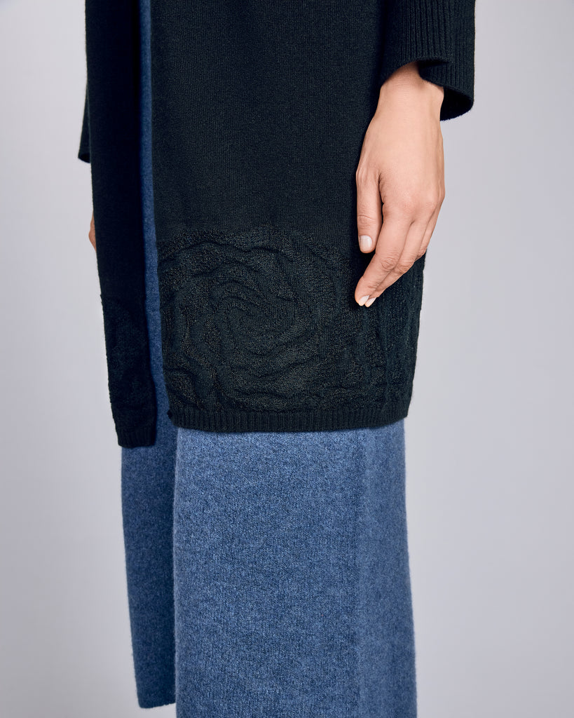 Knit-in floral “lace” detailing at the hem of this Arya cashmere sweater adds visual interest