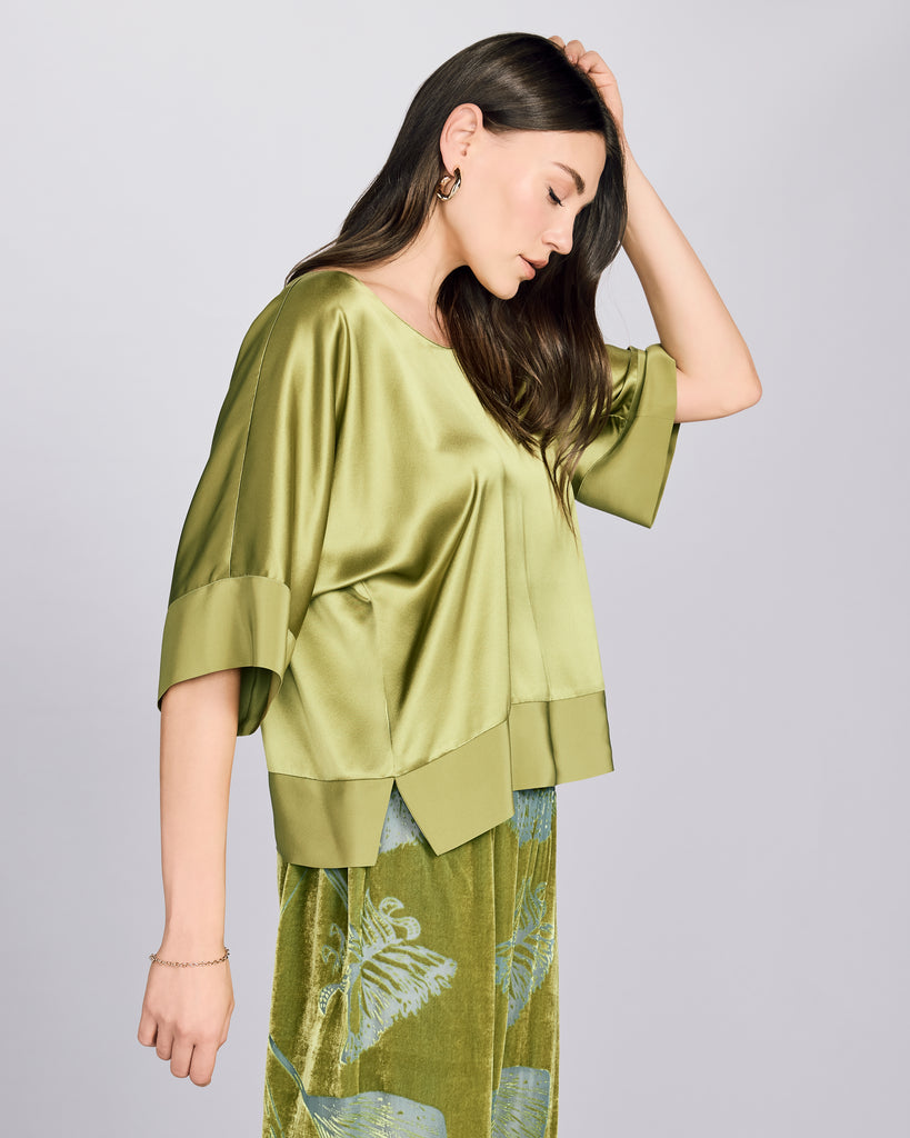 Classic silk shirt from Christine Vancouver is made from 19 momme chartreuse green silk charmeuse with silk crepe binding at the sleeves and hem