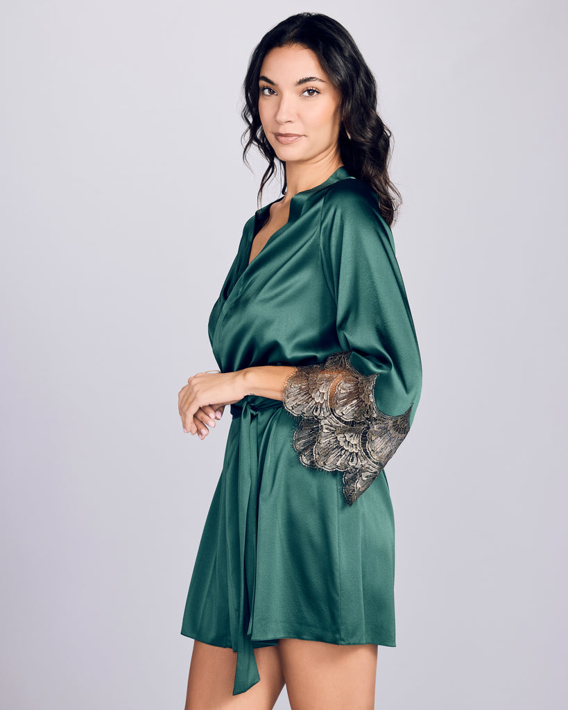 Classic Matinee silk robe from Gilda & Pearl is crafted from a decadent emerald green silk with gold lace at the sleeves