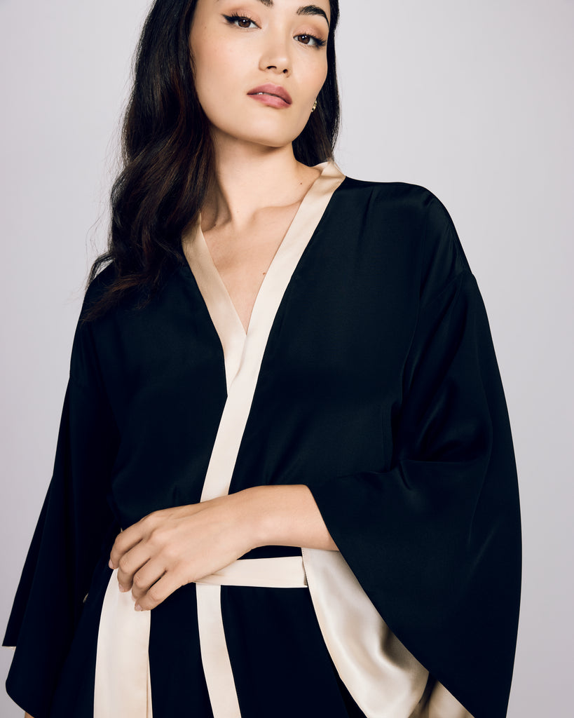 Classic Nights in Paris kimono robe from Gilda & Pearl is crafted from lightweight black silk crepe de chine with ivory silk charmeuse accents