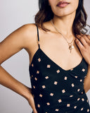 The Voyage silk slip dress from Gilda & Pearl has adjustable silk spaghetti straps and darts at the bust for fit