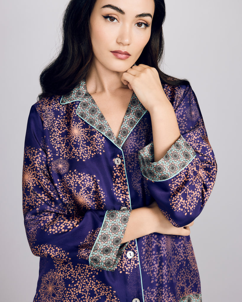 Exquisite Isa Hanabi Violin silk pajama from Karma on the Rocks is crafted from a luxurious purple silk twill with a rose gold print and geometric turquoise silk print accents