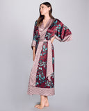 Full length Kazari Aqua robe from Karma on the Rocks is crafted from a decadent burgundy red silk charmeuse with a gingko print in shades of teal and contrast red and silver geometric print