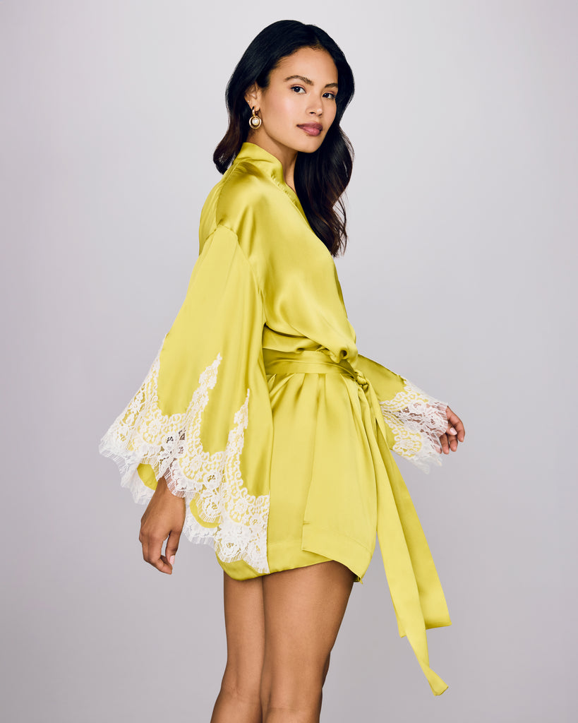 Classic Arielle short robe from Layalina is crafted from neon chartreuse silk with lavish ivory lace appliqué at the sleeves&nbsp;