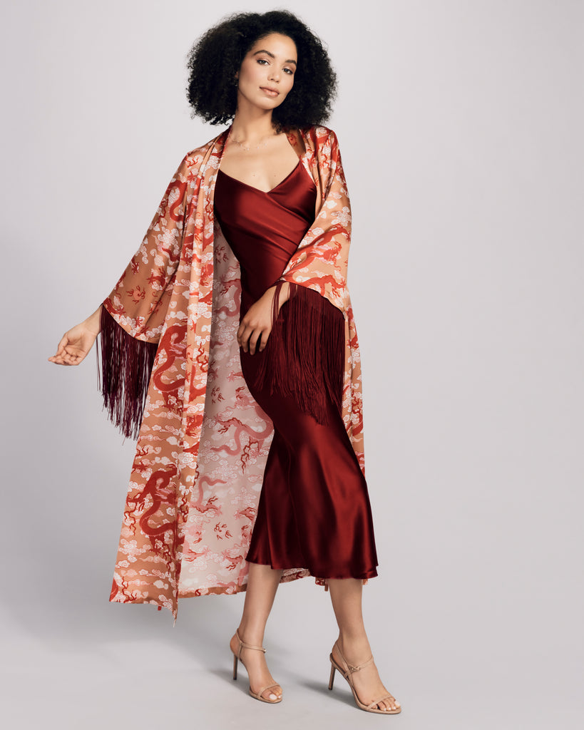 Gilda & Pearl's Lili robe has ruby red tassel detailing at the 3/4 sleeves the ends of the waist tie