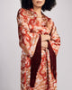 Luxurious Lili robe from Gilda & Pearl is crafted from a rose gold silk with a dragon pattern in shades of pink and red