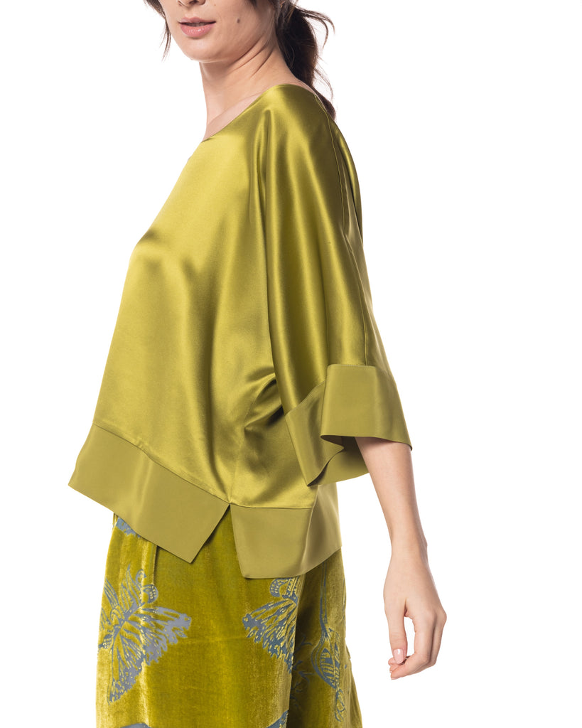 Classic silk shirt from Christine Vancouver is made from 19 momme chartreuse green silk charmeuse with silk crepe binding at the sleeves and hem